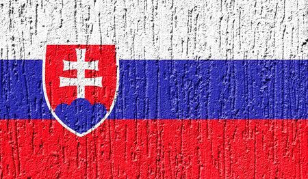 Flag of Slovakia close up painted on a cracked wallの写真素材
