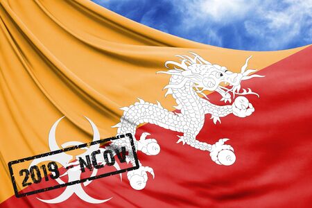 Novel coronavirus disease named 2019-nCoV with Butane flag closeup on blue sky backgroundの写真素材