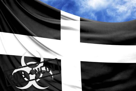 Novel coronavirus disease named 2019-nCoV with St Piran flag closeup on blue sky backgroundの写真素材