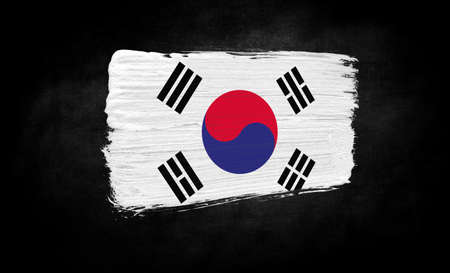 smear of paint in the form of the flag of South Korea close-up on a black backgroundの写真素材
