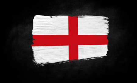 smear of paint in the form of the flag of England close-up on a black backgroundの写真素材