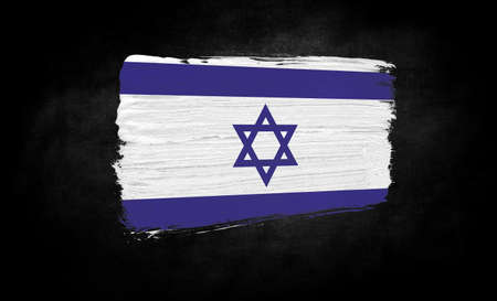 smear of paint in the form of the flag of Israel close-up on a black backgroundの写真素材