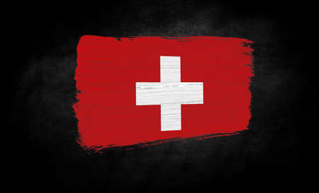 smear of paint in the form of the flag of Switzerland close-up on a black backgroundの写真素材