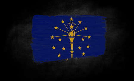 smear of paint in the form of the flag of State of Indiana close-up on a black backgroundの写真素材