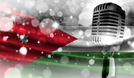 Microphone on a background of a blurry Jordan flag close-up, a design concept for your layout with a good place for text and images.の写真素材