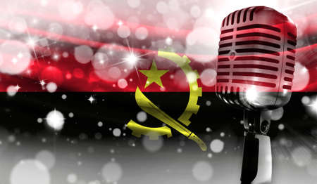 Microphone on a background of a blurry Angola flag close-up, a design concept for your layout with a good place for text and images.の写真素材