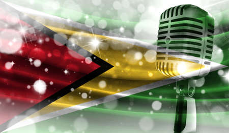 Microphone on a background of a blurry Guyana flag close-up, a design concept for your layout with a good place for text and images.の写真素材