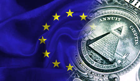 Flag of European Union on a fabric with an American dollar close-up.