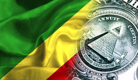 Flag of Congo, Republic on a fabric with an American dollar close-up.の写真素材