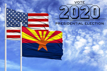 US elections in November 2020, against a blue sky, two flagpoles with the flag of America and the State of Arizona.の写真素材