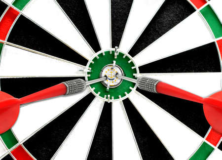 Close-up of a dart board with an imprinted flag of State of Rhode Island and Providence Plantations in the center. The concept of achieving goals.の写真素材