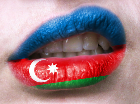 Female lips close up with a picture flag of Azerbaijan. learning languages.の写真素材