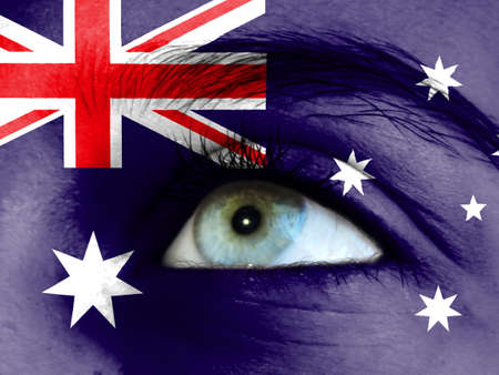 Close up view of a young girl. The flag of Australia is painted on the girl face.の写真素材