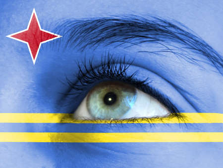 Close up view of a young girl. The flag of Aruba is painted on the girl face.の写真素材