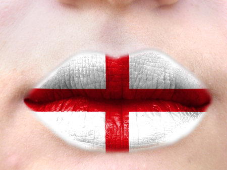 Female lips close up with a picture flag of England. learning languages.の写真素材