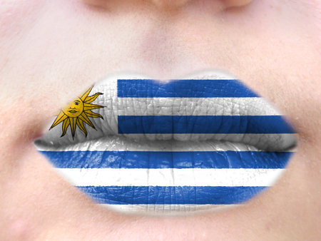 Female lips close up with a picture flag of Uruguay. learning languages.の写真素材