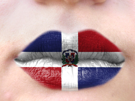 Female lips close up with a picture flag of the Dominican Republic. learning languages.の写真素材