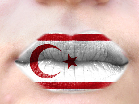 Female lips close up with a picture flag of Turkish Republic of Northern Cyprus. learning languages.の写真素材