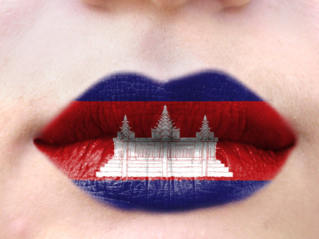 Female lips close up with a picture flag of Cambodia. learning languages.の写真素材