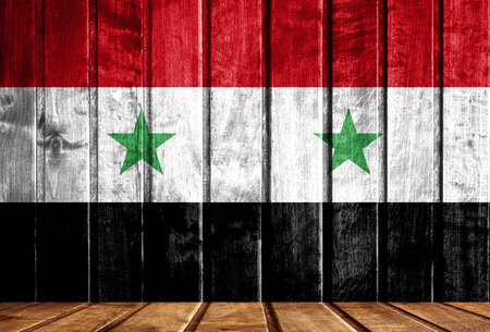 Wooden background with a flag of Syria. There is a place for your text in the photo.の写真素材