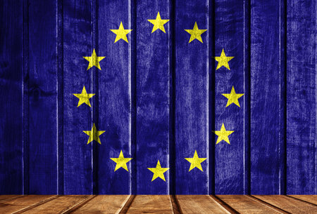 Wooden background with a flag of European Union. There is a place for your text in the photo.の写真素材