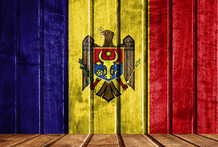 Wooden background with a flag of Moldova. There is a place for your text in the photo.の写真素材