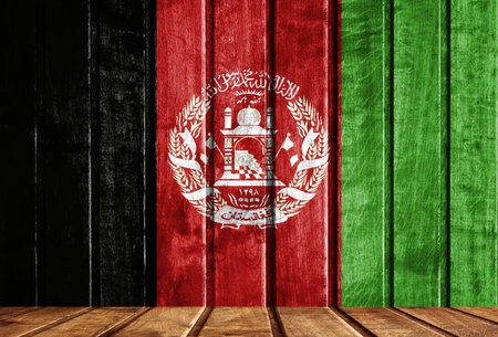 Wooden background with a flag of Afghanistan. There is a place for your text in the photo.の写真素材