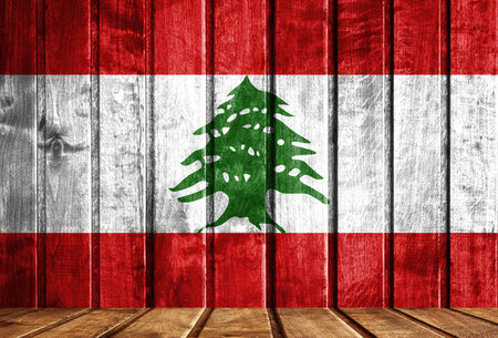 Wooden background with a flag of Lebanon. There is a place for your text in the photo.の写真素材