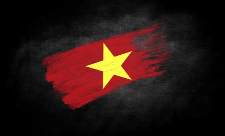 smear of paint in the form of the flag of Vietnam close-up on a black backgroundの写真素材