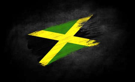 smear of paint in the form of the flag of Jamaica close-up on a black background