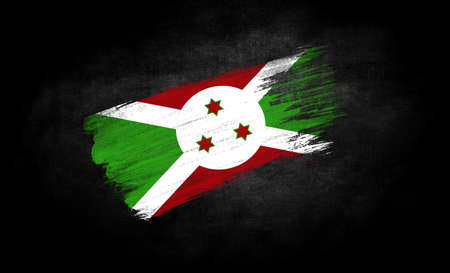 smear of paint in the form of the flag of Burundi close-up on a black backgroundの写真素材