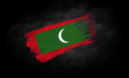 smear of paint in the form of the flag of Maldives close-up on a black background