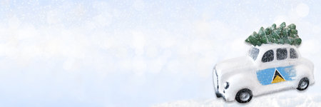 A miniature white Christmas car with a flag of Saint Lucia. Concept of new year or christmas with place for your text.の写真素材