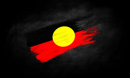 smear of paint in the form of the flag of Australian Aboriginal close-up on a black backgroundのeditorial素材
