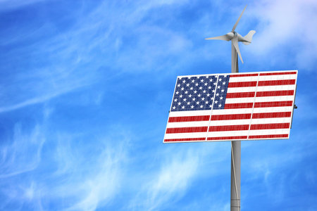 Solar panels against a blue sky with a picture of the flag of Americaの写真素材
