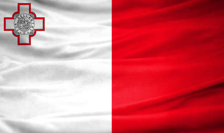 Realistic flag of Malta on the wavy surface of fabric