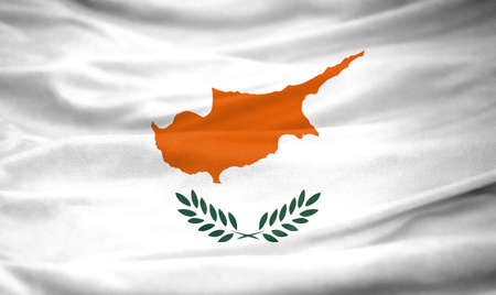 Realistic flag of Cyprus on the wavy surface of fabricの写真素材