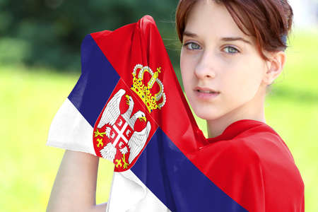 Young girl holding the flag of Serbia close upの写真素材