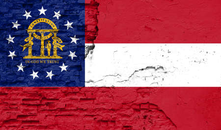 State of Georgia flag is painted onto an old brick wallの写真素材