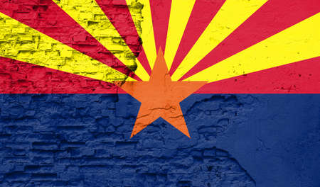 State of Arizona flag is painted onto an old brick wallの写真素材
