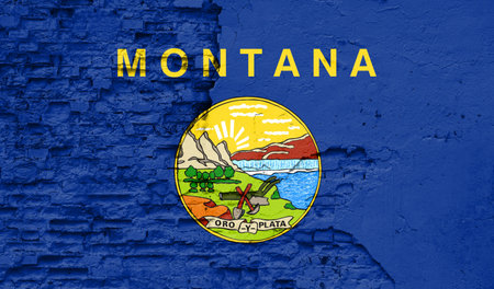 State of Montana flag is painted onto an old brick wallの写真素材