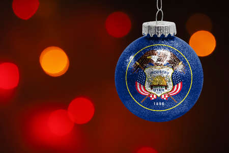 Colorful blurred background and applied the flag of State of Utah on the New Year's toy. New Year 2022 Celebrationの写真素材