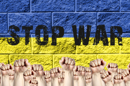 Raised fists up against the background of the flag of Ukraine with the inscription stop war, the...