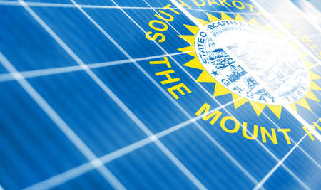Solar panels on the background of the image of the flag of State of South Dakota