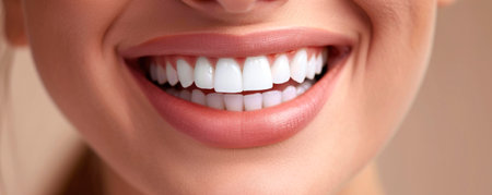 Beautiful female smile after teeth whitening procedure. Dental care. Dentistry concept.の素材