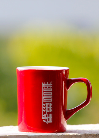 Red coffee cup on the window sillのeditorial素材