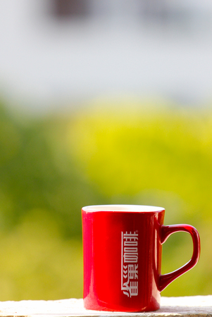 Red coffee cup on the window sillのeditorial素材