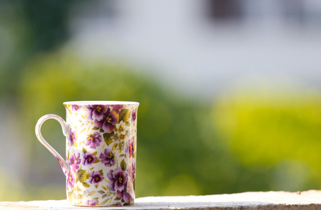 Purple cup on the window sill
