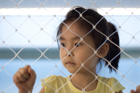 The little girl playing at the playgroundの写真素材