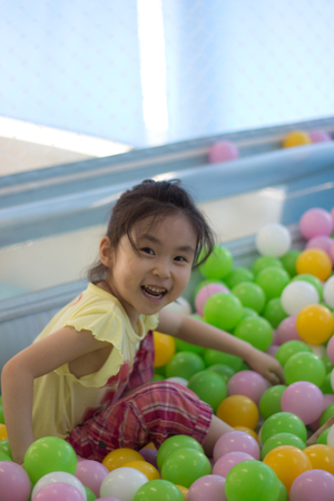The little girl playing at the playgroundの写真素材
